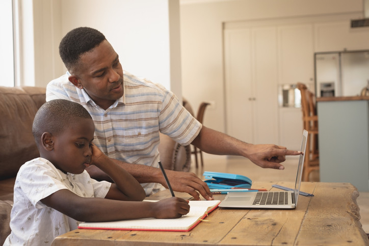 dad helping son learn at home