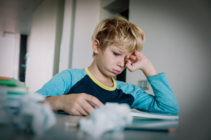 boy frustrated online learning